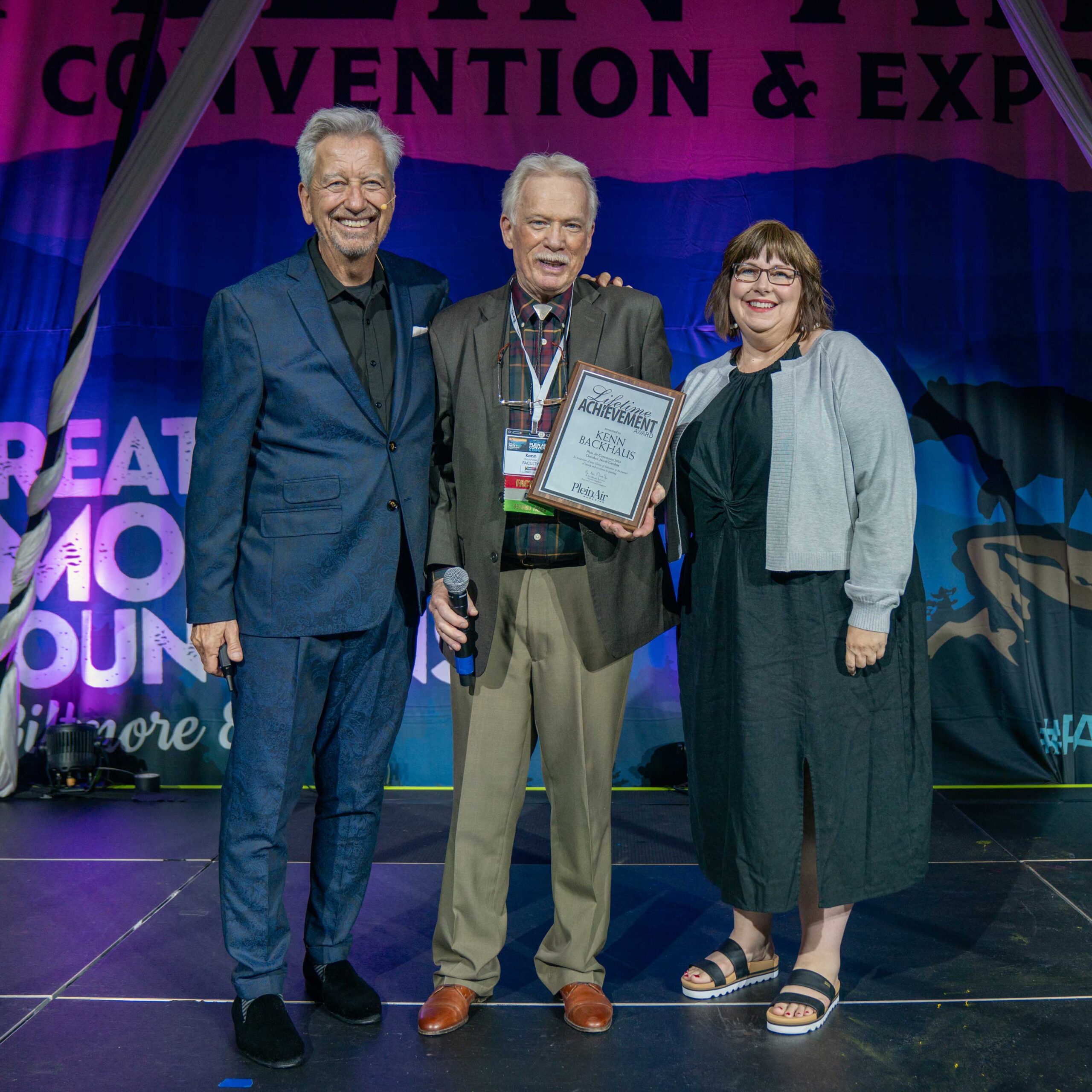 CEO and host Eric Rhoads, Lifetime Achievement Award Winner Kenn Backhaus, and PleinAir Magazine Editor-in-Chief Kelly Kane