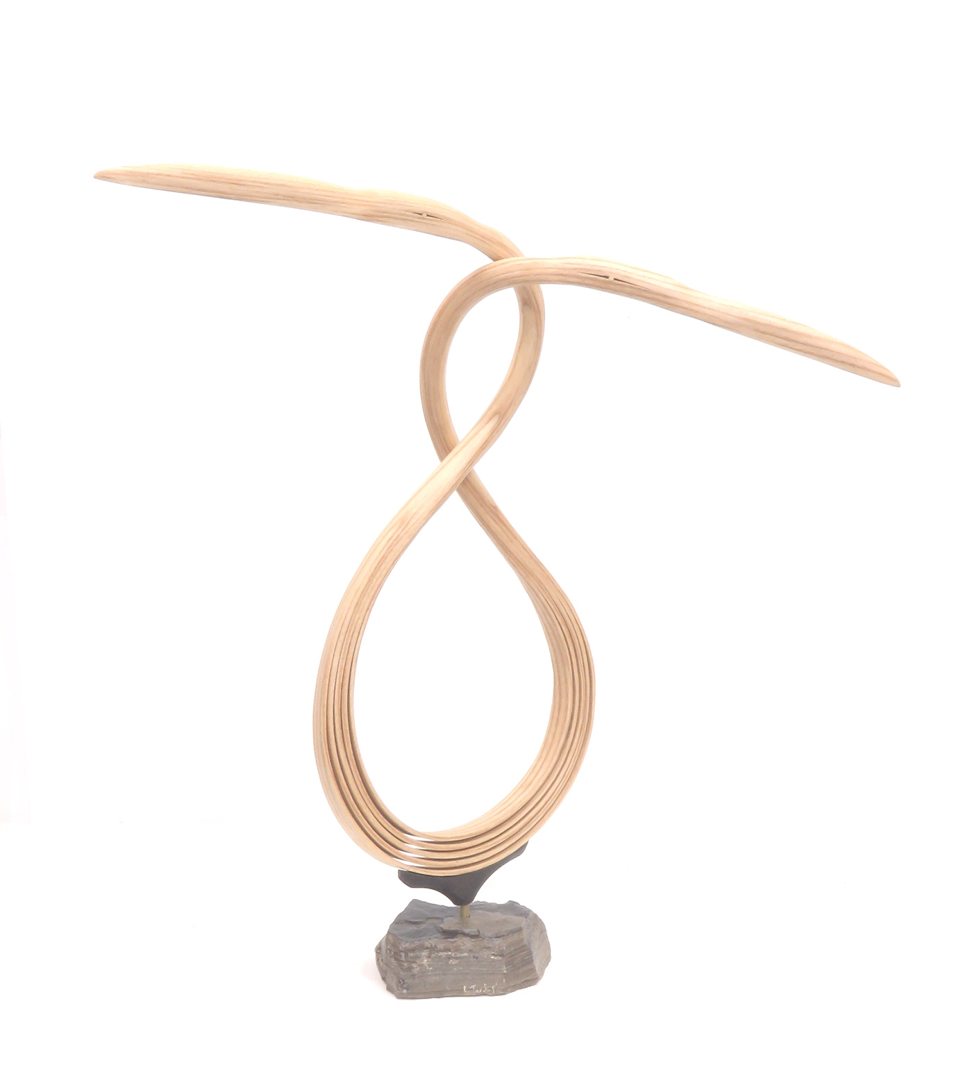 wood carving of abstract bird with white background